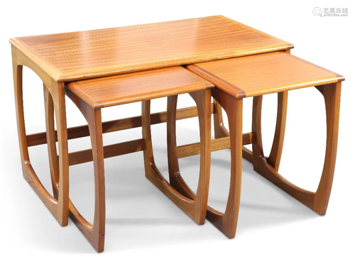 A G-PLAN QUADRILLE NEST OF THREE TEAK OCCASIONAL TABLES, CIR...