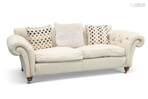 A CONTEMPORARY SOFA, with buttoned arms and two loose cushio...