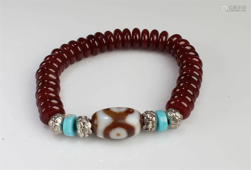 A Beaded Bracelet with a Dzi Bead