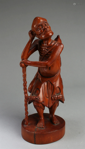 A Carved Boxwood Monk Figurine