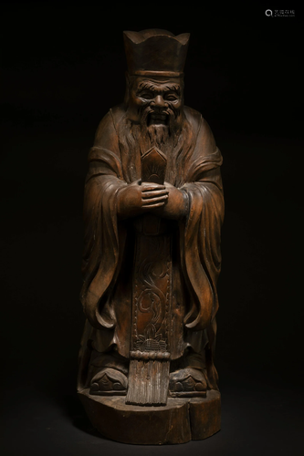 A Carved Wooden Deity Figurine