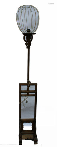 A Wooden Standing Lamp