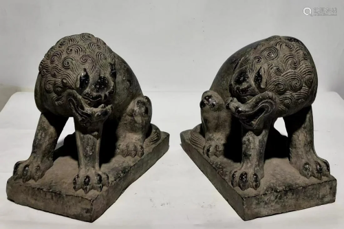 A Pair of Carved Stone Mythical Beast Statues