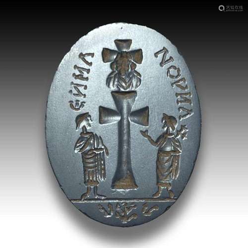 A HEMATITE RUSTIC ANGELIC INTAGLIO DEPICTING CHRIST AND PETE...