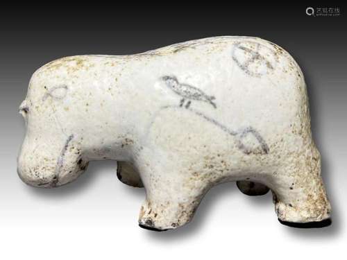 An Egyptian white glazed painted limestone hippopotamus, Mid...