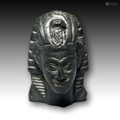 AN EGYPTIAN OBSIDIAN PORTRAIT HEAD OF A PHARAOH NEW KINGDOM,...