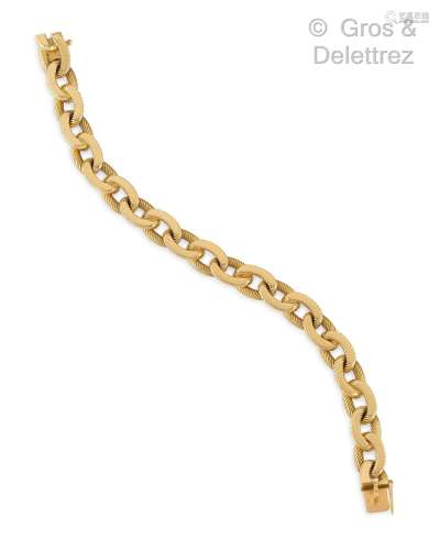 Bracelet articulé en or jaune, composé de maillons ovales to...