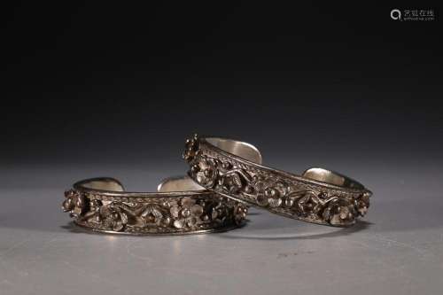 TWO CHINESE SILVER BANGLES CAST WITH 'PRUNUS'
