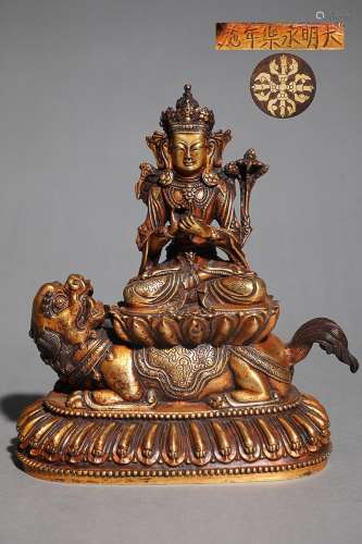 CHINESE GILT-BRONZE FIGURE OF GUANYIN ON LION, 'MING YON...