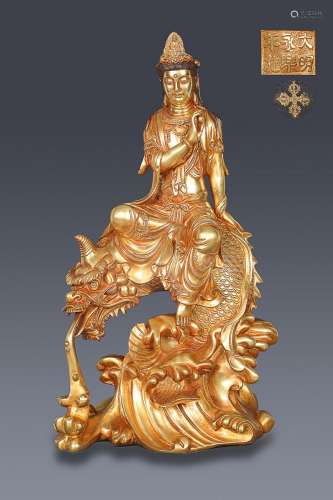CHINESE GILT-BRONZE FIGURE OF GUANYIN ON DRAGON, 'MING Y...