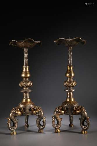 TWO CHINESE GILT-BRONZE BEAST-LEGGED CANDLE HOLDERS