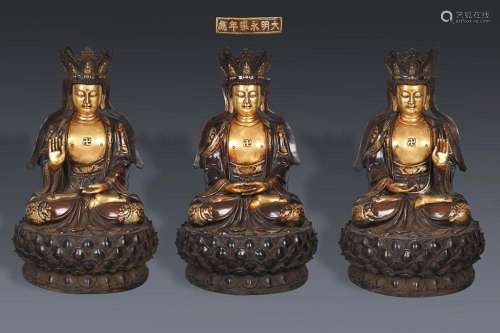 THREE CHINESE PARCEL-GILT BRONZE FIGURE OF TRIKALA BUDDHAS, ...