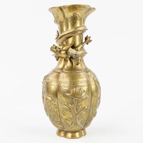 A Chinese bronze vase decorated with a dragon. (11 x 13 x 25...