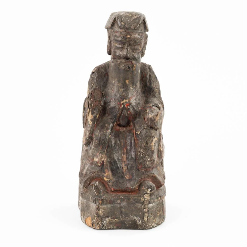 A small and antique wood sculptured statue of a Chinese figu...