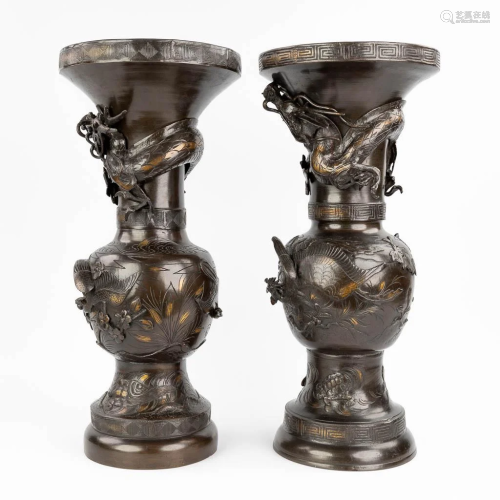 A pair of bronze Japanese bronze vases with a flower and dra...