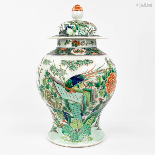 A Chinese baluster vase with lid, with a fine hand-painted d...