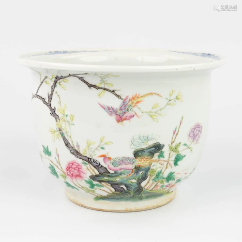 A Chinese Cache-pot flower pot made of porcelain, with a han...