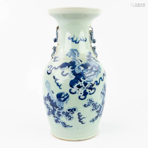 A Chinese vase decorated with a blue-white foo dog (42 x 21 ...