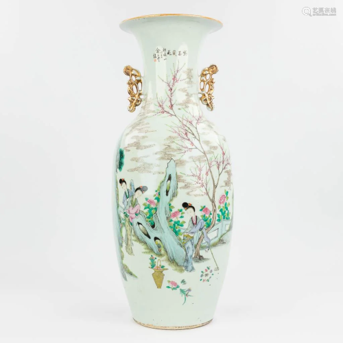 A Chinese vase made of porcelain and decor of ladies near a ...
