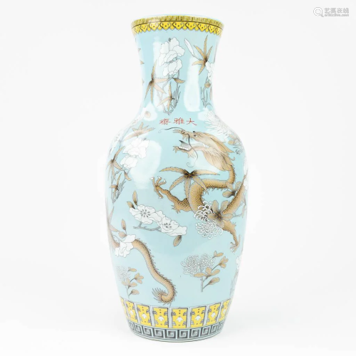 A Chinese vase made of porcelain and decorated with Dragons....