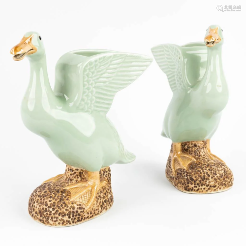 A pair of Chinese ducks made of celadon porcelain and marked...