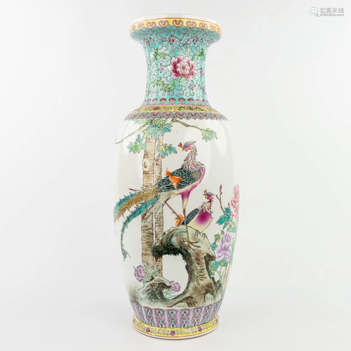 A Chinese vase made of porcelain and decorated with peacocks...