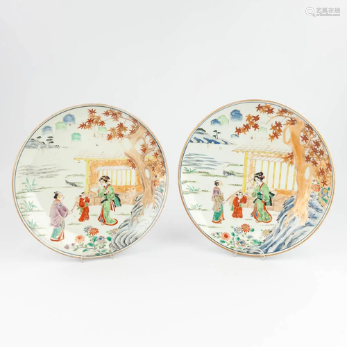 A pair of Japanese plates, with images of a lady and childre...