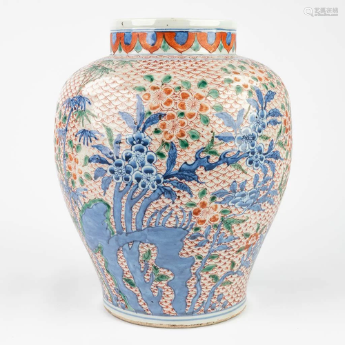 A Chinese vase with underglaze blue and overglaze red decor....