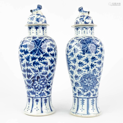 A pair of small baluster vases with lid, and blue-white deco...