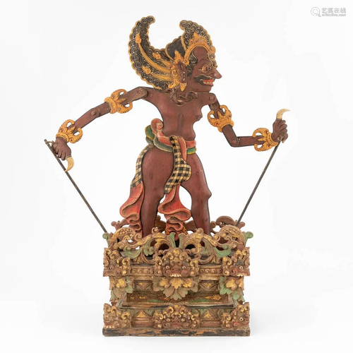 A wood sculptured 'Barong Dancer', Java, Bali. (30...