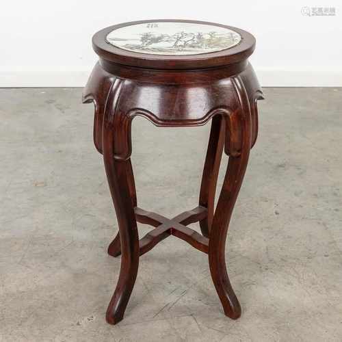 A Chinese side table with porcelain plaque tabletop. 20th C....