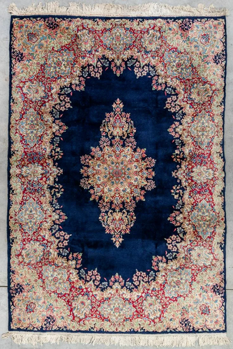 An Oriental hand-made carpet, Kerman. (310 x 215 cm)