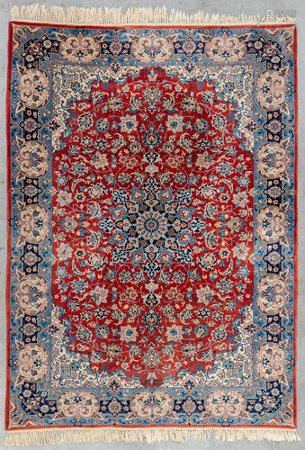 A Persian hand-made carpet, Kirman. (246 x 179 cm)