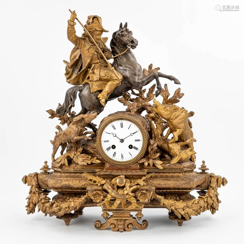 An antique mantle clock with hunting scÃ¨ne, gold-plated spe...