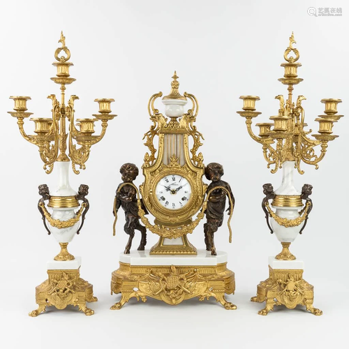 A three-piece mantle clock made of bronze and marble, Empire...