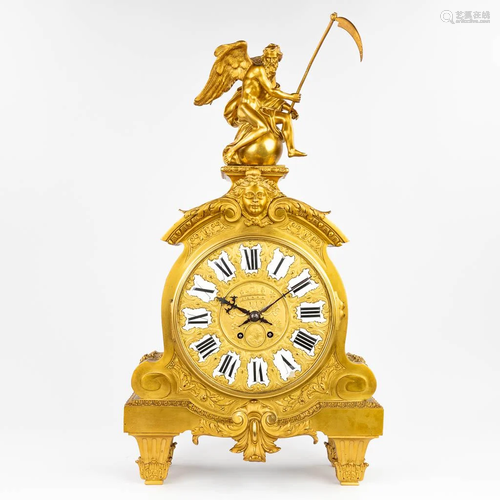 A large mantle clock 'Father Time' made of gilt br...