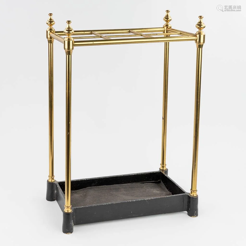 An brass and cast-iron umbrella stand, English. (23 x 44 x 6...