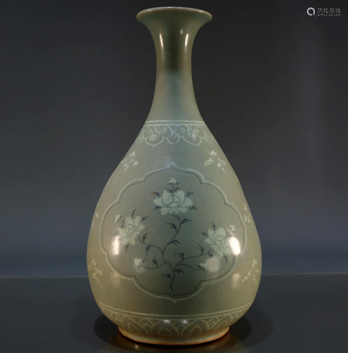 A Korean Celadon-Glazed 'Dragon' Bottle Vase