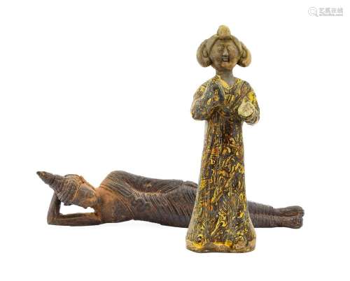 A Chinese Earthenware Figure of a Maiden, in Tang style, wea...