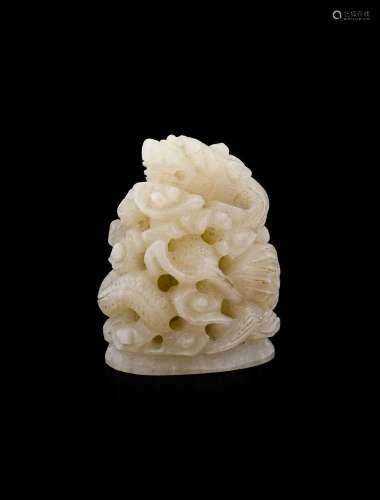 A Chinese Jade Dragon, in 18th century style, coiled amongst...