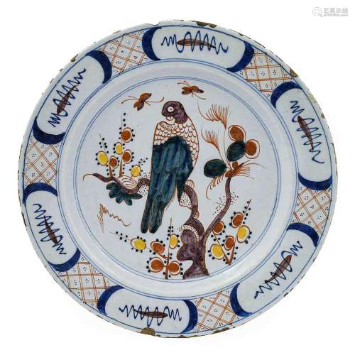 A Delft Dish, mid 18th century, painted in colours with a pa...