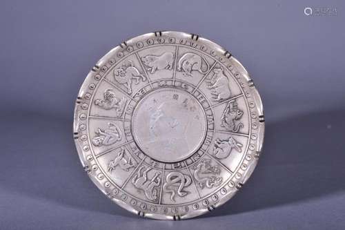 A CARVED SIVER DISH WITH CHINA ONE DOLLAR SILVER COIN