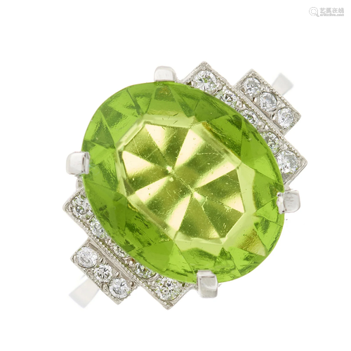 A platinum oval-shape peridot dress ring