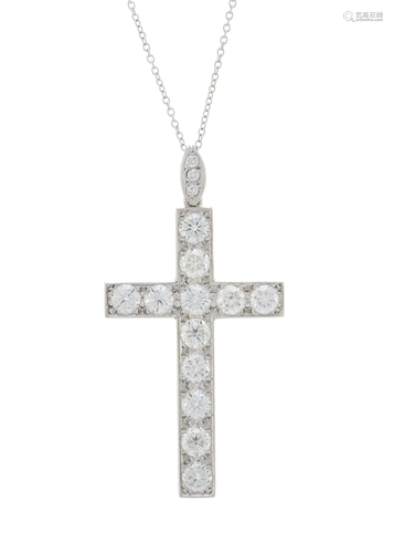 An 18ct gold brilliant-cut diamond cross