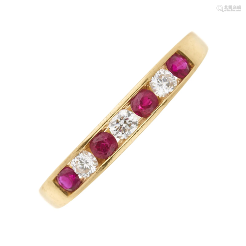 An 18ct gold circular-shape ruby and bri