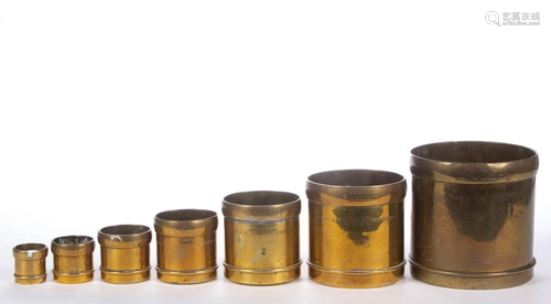 GRADUATED SET OF SEVEN BRITISH COLONIAL BRASS SEER MEASURES