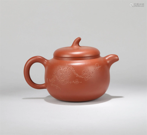 A Chinese Carved Yixing Clay Tea Pot with Lid