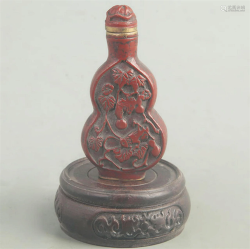 A FINE RED CARVED LACQUER BUTTERFLY CARVING SNUFF BOTTLE