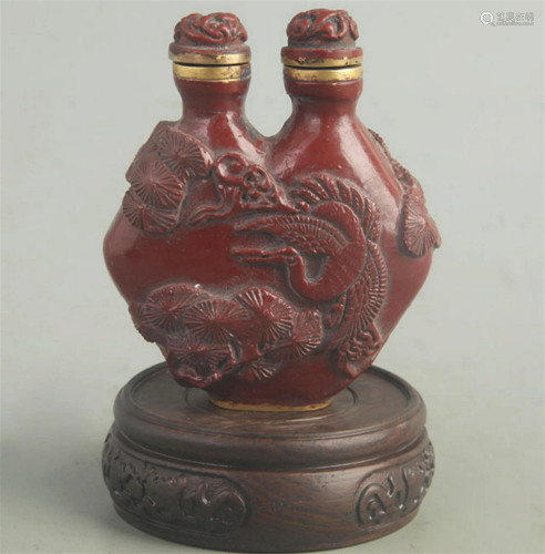 A FINE RED CARVED LACQUER BUTTERFLY CARVING SNUFF BOTTLE
