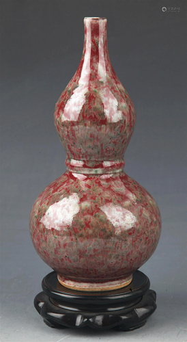 A RED GLAZED CALABASH SHAPE BOTTLE